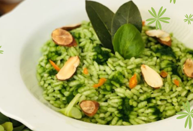 Risotto all’alloro con purea di valeriana, mandorle tostate e scorza di mandarino